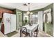 Inviting dining area with a table setting, view of the backyard, and easy access to the kitchen at 12026 W Salter Dr, Sun City, AZ 85373