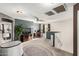 Comfortable living area with neutral carpet, blue accent wall, and ceiling fan at 12026 W Salter Dr, Sun City, AZ 85373