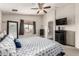 Comfortable primary bedroom with a queen bed and access to ensuite bath with a shower at 12026 W Salter Dr, Sun City, AZ 85373