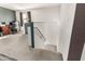 Carpeted staircase leading to an upstairs area with a neutral carpet and walls at 12026 W Salter Dr, Sun City, AZ 85373