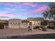 Contemporary home featuring desert landscaping, three-car garage, and modern architectural elements at 13631 E Windrose Dr, Scottsdale, AZ 85259
