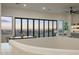 Living room with a view to the outside and dining set at 13631 E Windrose Dr, Scottsdale, AZ 85259