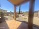 An outdoor covered living space in the backyard with built-in seating and fire pits at 1390 E Jasper Dr, Gilbert, AZ 85296