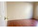 Clean, vacant bedroom offering hardwood floors, neutral decor and a bright sunny exposure at 1390 E Jasper Dr, Gilbert, AZ 85296