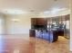Gourmet kitchen with stainless steel appliances, dark cabinets, and an island with a granite countertop at 1390 E Jasper Dr, Gilbert, AZ 85296