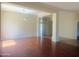 Inviting open-concept living area with beautiful wood floors and large columns, perfect for entertaining at 1390 E Jasper Dr, Gilbert, AZ 85296