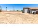 Expansive backyard enclosed by a privacy wall provides ample space for outdoor activities at 1501 E Sunland Ave, Phoenix, AZ 85040