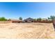 Large, bare backyard is surrounded by a block wall for privacy at 1501 E Sunland Ave, Phoenix, AZ 85040