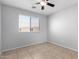 Bright bedroom with tile floors has ample sunlight and a ceiling fan at 1501 E Sunland Ave, Phoenix, AZ 85040