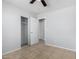 Bedroom featuring tile floors and a closet, offering comfort and storage space at 1501 E Sunland Ave, Phoenix, AZ 85040