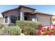 Home exterior shows a manicured front yard with desert landscaping and a covered entry at 1501 E Sunland Ave, Phoenix, AZ 85040