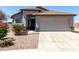 Charming single-story home with a two-car garage, desert landscaping, and a classic tile roof at 1501 E Sunland Ave, Phoenix, AZ 85040