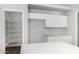 Bright kitchen area features white cabinets and ample counter space, offering a clean and modern design at 1501 E Sunland Ave, Phoenix, AZ 85040
