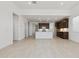 Bright, open kitchen featuring dark wood cabinets, modern appliances, a large island, and sleek countertops at 15349 W Cottontail Ln, Surprise, AZ 85387