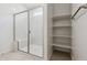 Modern bathroom featuring an enclosed walk-in shower and built-in shelving at 15349 W Cottontail Ln, Surprise, AZ 85387