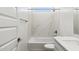 A bathroom features a white marble-look shower and quartz countertop sink at 15357 W Cottontail Ln, Surprise, AZ 85387