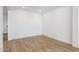 Clean, empty room with light tile floors and white walls, ready for personalization at 15357 W Cottontail Ln, Surprise, AZ 85387