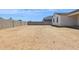 A spacious backyard area featuring block fencing offering privacy and security at 15365 W Cottontail Ln, Surprise, AZ 85387