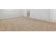 Spacious carpeted bedroom with walk-in closet and a view to an ensuite bathroom at 15365 W Cottontail Ln, Surprise, AZ 85387