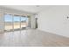 Bright living area with sliding glass doors to the backyard and tile flooring at 15365 W Cottontail Ln, Surprise, AZ 85387