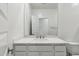 Modern bathroom features white marble countertop, sink, and vanity cabinet at 15402 W Cottontail Ln, Surprise, AZ 85387
