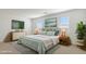 Serene bedroom featuring a cozy bed, matching nightstands and bright natural light at 15402 W Cottontail Ln, Surprise, AZ 85387