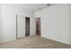 Bright bedroom featuring a neutral carpet, closet and ensuite bathroom access at 15402 W Cottontail Ln, Surprise, AZ 85387