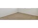 Cozy carpeted bedroom features a window, base trim, and white walls at 15402 W Cottontail Ln, Surprise, AZ 85387