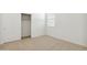 Bedroom featuring white walls, neutral carpet and a window at 15402 W Cottontail Ln, Surprise, AZ 85387