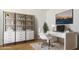 Bright home office with modern desk, stylish shelving and a comfortable executive chair at 15402 W Cottontail Ln, Surprise, AZ 85387