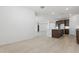 Bright living room featuring recessed lighting, modern flooring, and ample natural light at 15429 W Cottontail Ln, Surprise, AZ 85387