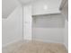 Walk-in closet featuring built-in shelving and ample storage space for an organized wardrobe at 15429 W Cottontail Ln, Surprise, AZ 85387