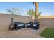Charming backyard featuring a cozy seating area with a fire pit creating a warm and inviting outdoor ambiance at 1673 S 171St Dr, Goodyear, AZ 85338