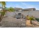 Backyard features an outdoor grill and rock landscaping at 1673 S 171St Dr, Goodyear, AZ 85338