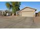 Charming single-story home with neutral palette, low maintenance desert landscaping, and two car garage at 1673 S 171St Dr, Goodyear, AZ 85338