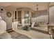Inviting front porch with a welcome mat, decorative wreath, and a cozy seating area at 1673 S 171St Dr, Goodyear, AZ 85338