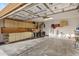 Organized garage featuring ample storage cabinets, workbench, and space for parking vehicles and recreational equipment at 1673 S 171St Dr, Goodyear, AZ 85338