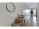 Inviting entryway with tile flooring, a decorative mirror, and a cozy bench at 1673 S 171St Dr, Goodyear, AZ 85338