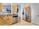 A kitchen featuring stainless steel appliances, granite countertops, and seamlessly connecting to the living area at 1673 S 171St Dr, Goodyear, AZ 85338