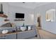 Spacious living room offering tile flooring, a comfortable sofa, and modern decor at 1673 S 171St Dr, Goodyear, AZ 85338