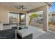 Covered patio featuring an outdoor seating area, ceiling fan and view of the yard at 1673 S 171St Dr, Goodyear, AZ 85338