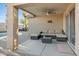 Inviting covered patio with wicker furniture creating a cozy outdoor seating area at 1673 S 171St Dr, Goodyear, AZ 85338
