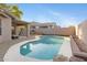 Beautiful backyard with a refreshing pool and patio, perfect for outdoor relaxation and entertaining at 1673 S 171St Dr, Goodyear, AZ 85338
