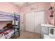This bedroom features a bunk bed and a white dresser with a vanity at 17937 W Westpark Blvd, Surprise, AZ 85388