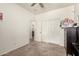 This bedroom includes a ceiling fan and sliding closet doors at 17937 W Westpark Blvd, Surprise, AZ 85388