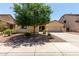 Charming single-story home featuring a well-manicured front yard and inviting curb appeal at 17937 W Westpark Blvd, Surprise, AZ 85388