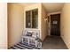 Inviting front porch with cozy bench, perfect for relaxing and enjoying the neighborhood at 17937 W Westpark Blvd, Surprise, AZ 85388