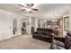 Spacious living room with an open floor plan and comfortable leather sofas at 17937 W Westpark Blvd, Surprise, AZ 85388