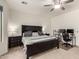 Main bedroom with a ceiling fan and dedicated workspace at 17937 W Westpark Blvd, Surprise, AZ 85388