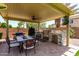 Outdoor kitchen complete with a grill, counter space, and bar seating for entertaining at 17937 W Westpark Blvd, Surprise, AZ 85388